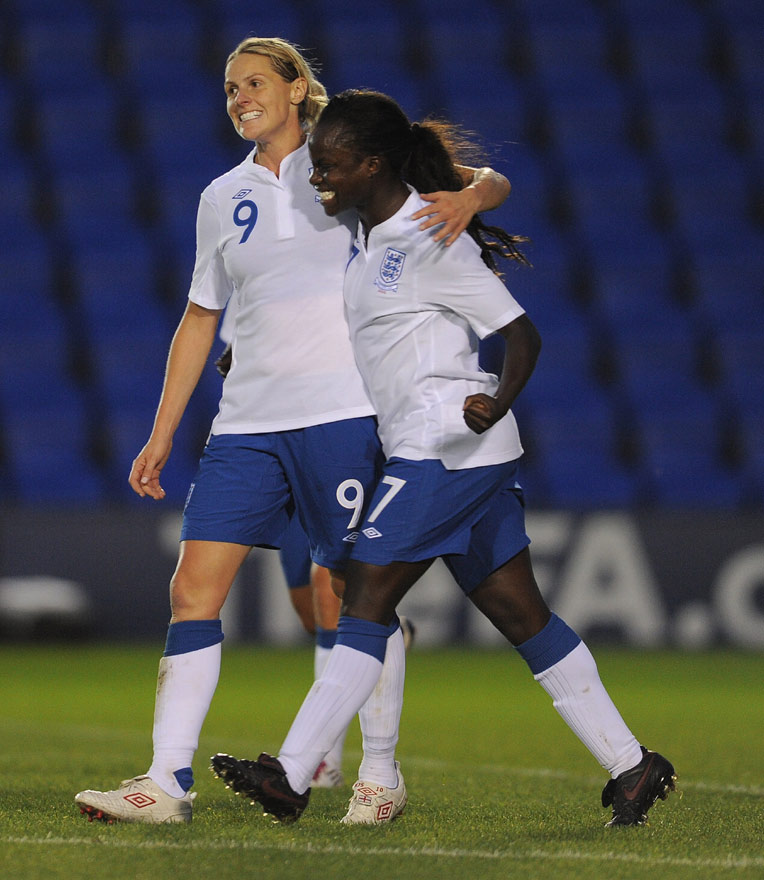 Kelly Smith (left) is congratulated by Eniola Aluko on scoring her 41st international goal, against Switzerland at Greenhouse Meadow Stadium.